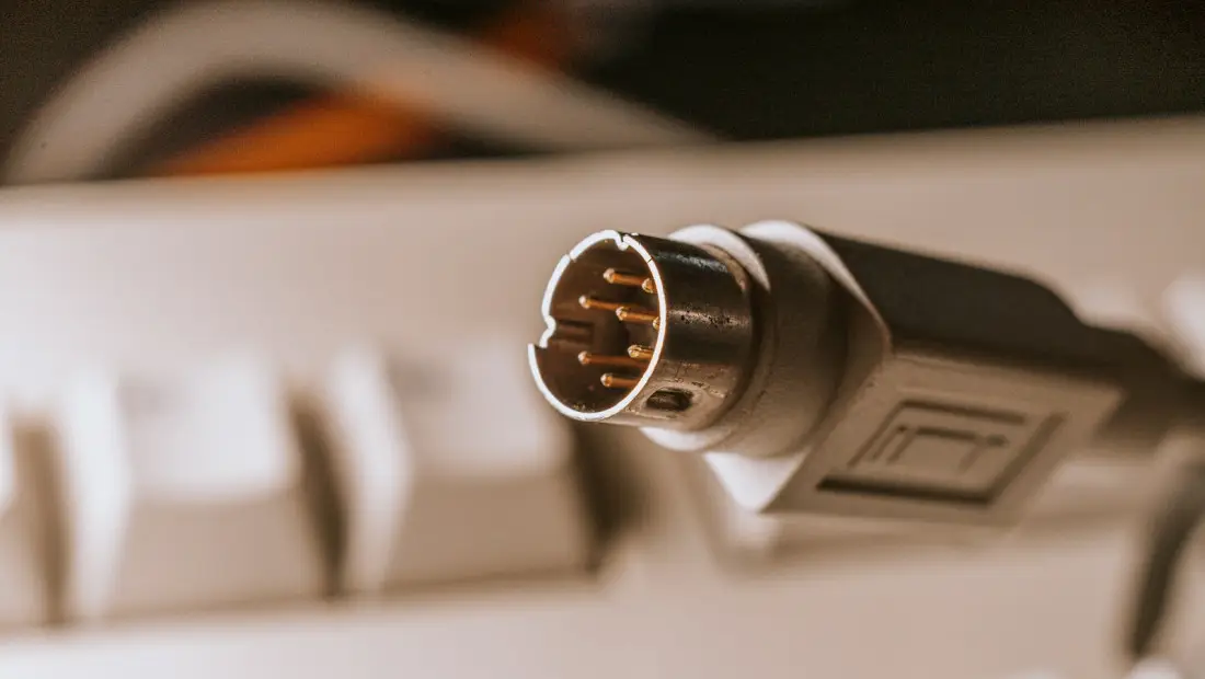 black and silver microphone on white computer keyboard