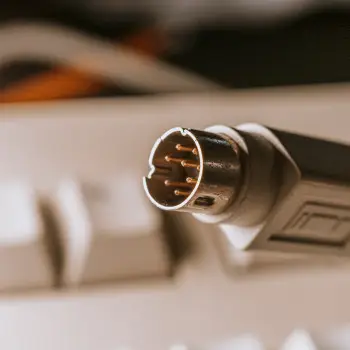 black and silver microphone on white computer keyboard